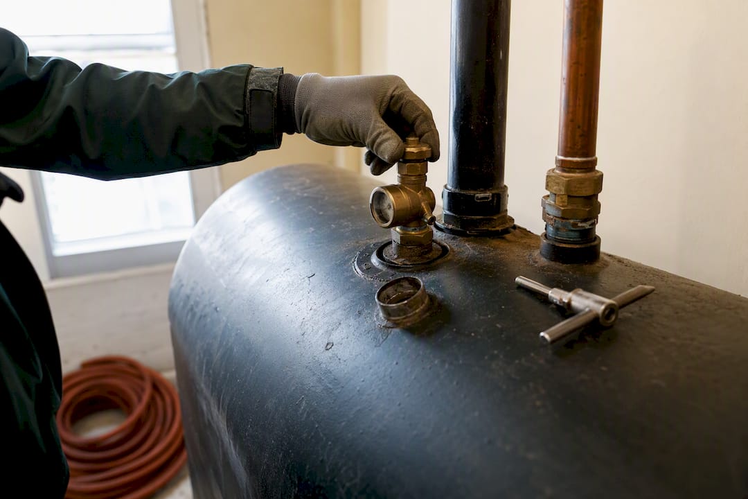 Inspector checking a residential oil tank