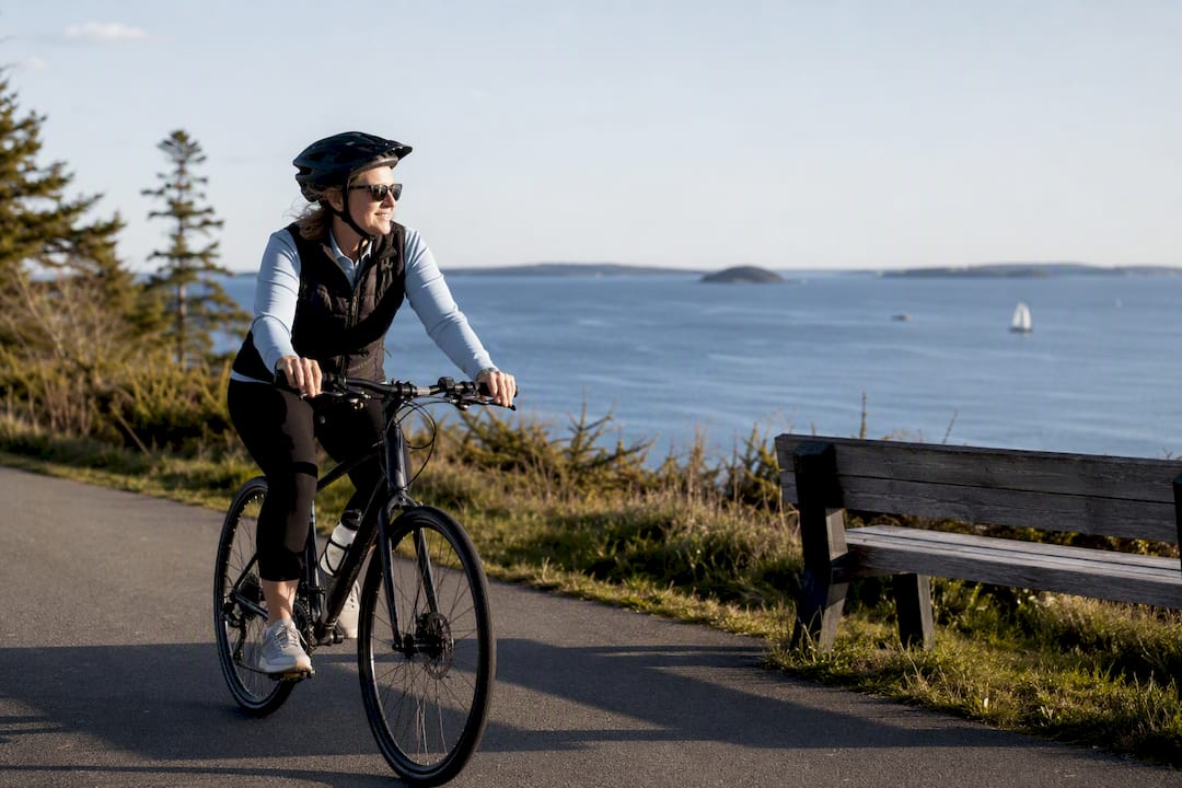 Cyclist riding Eastern Promenade waterfront trail