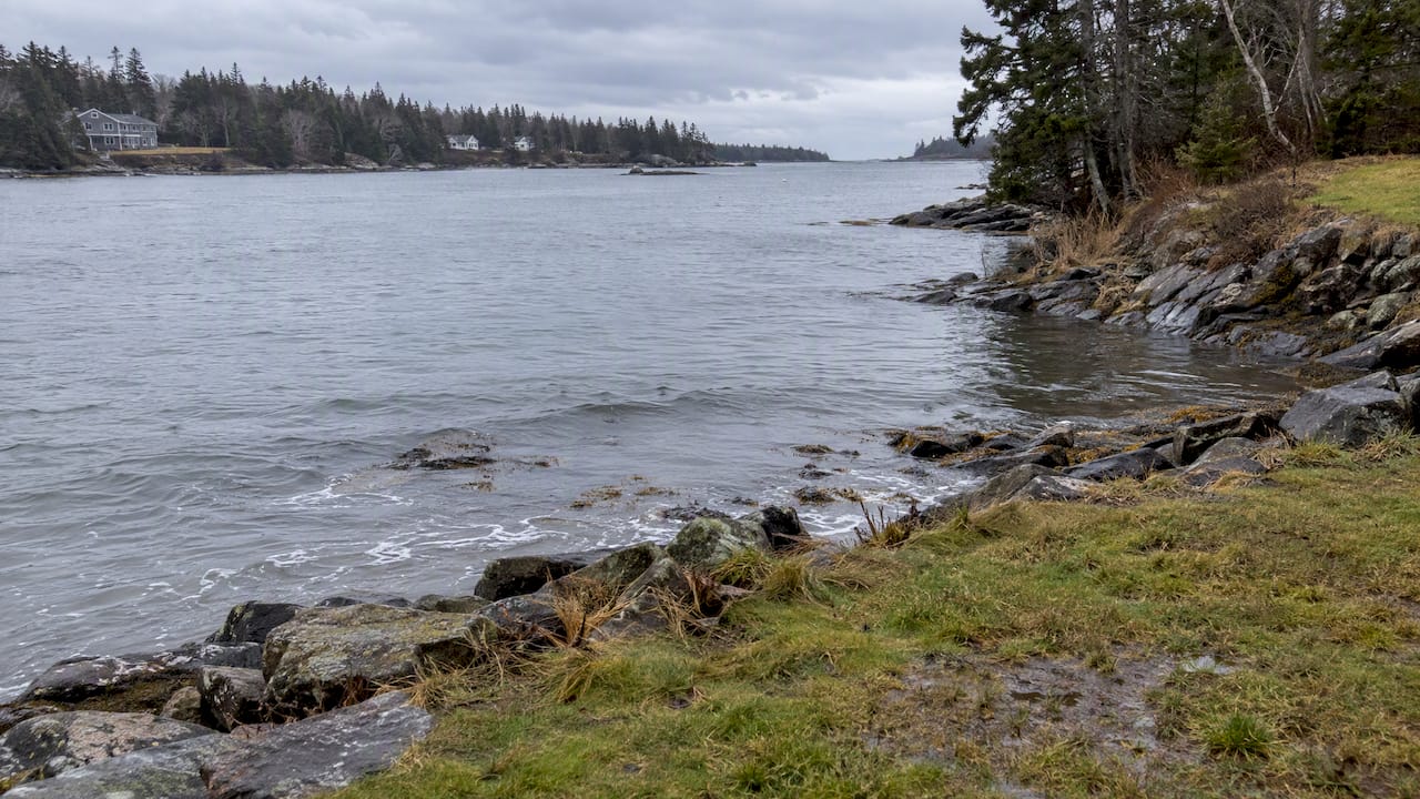 High tide reaching a Maine coastal lot