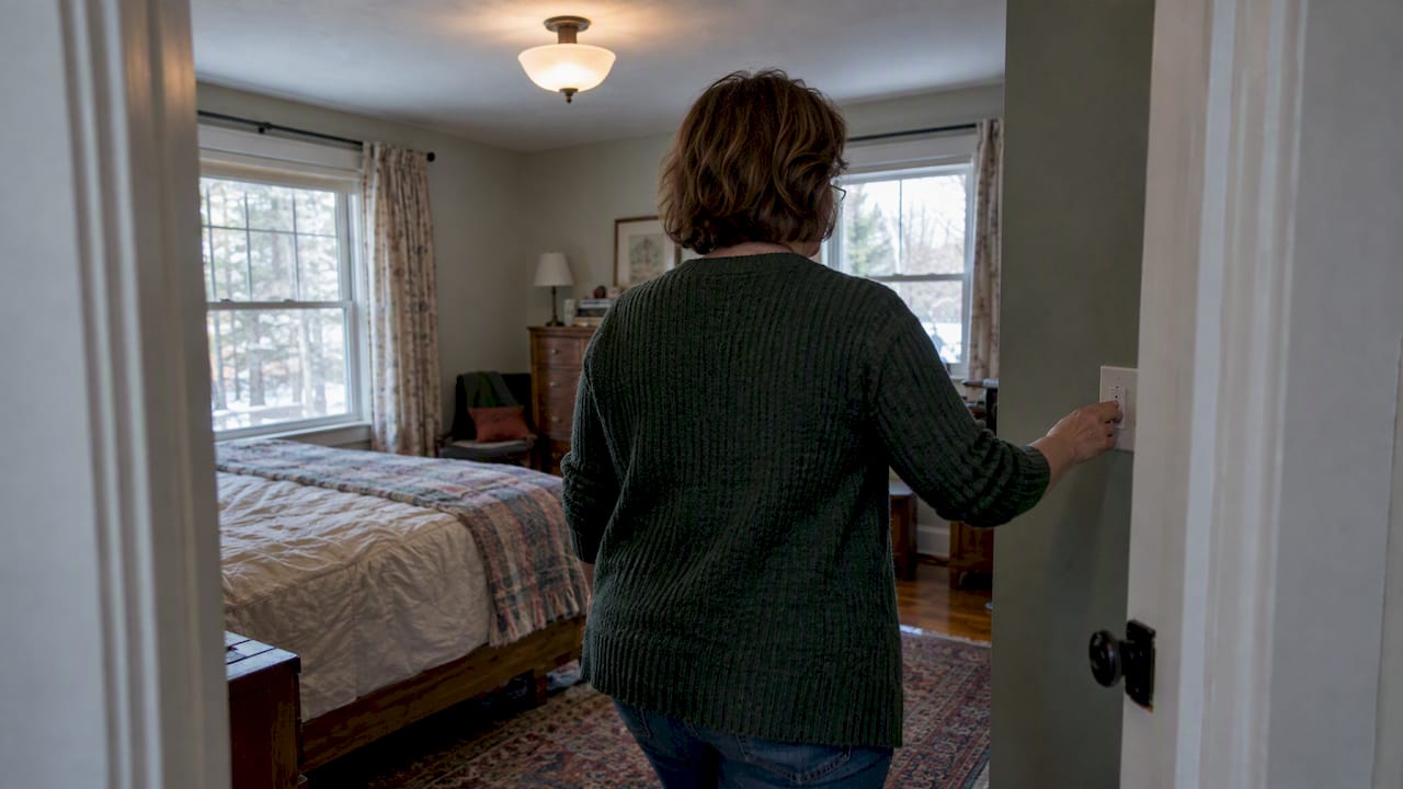 Homeowner turning on a light before listing photos